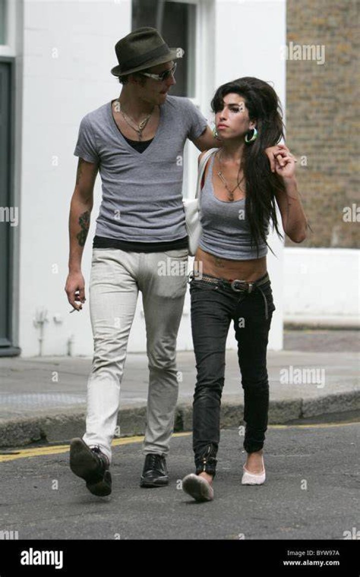 Amy Winehouse and husband Blake Fielder Civil getting on a train at