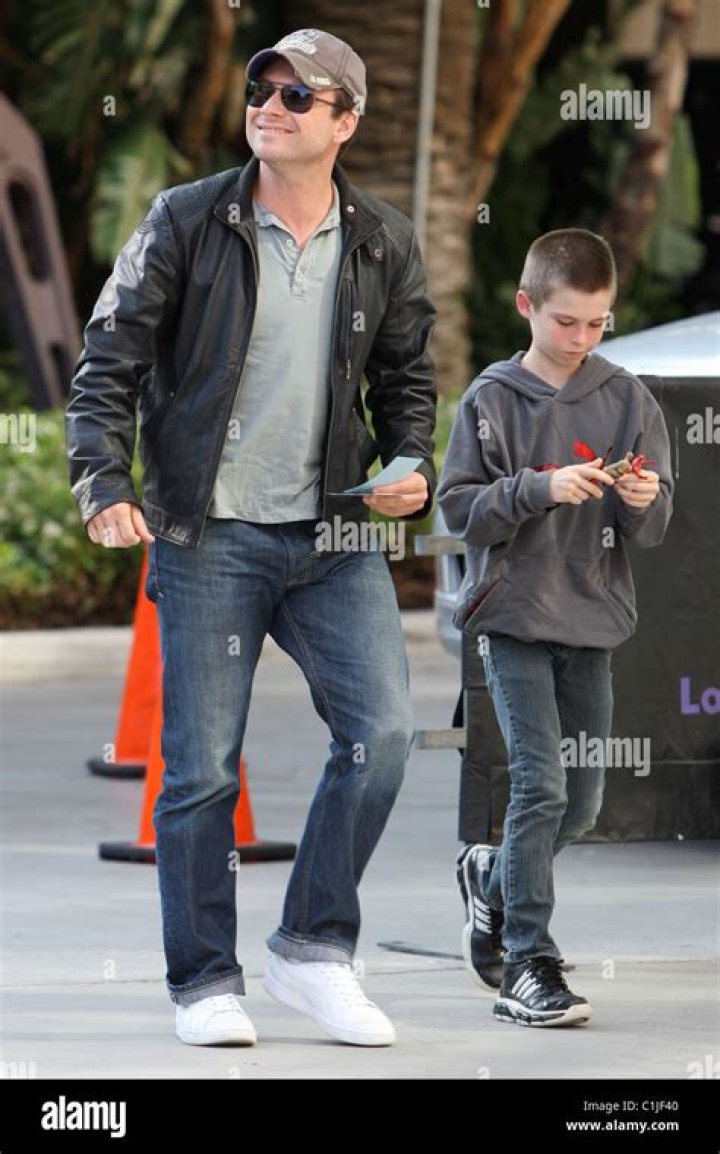 Christian Slater and his son Jaden, arrive for the first game of the