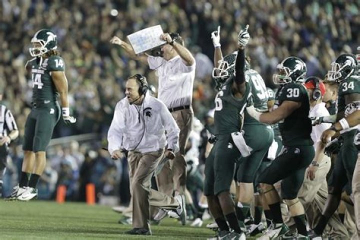 Mark Dantonio celebrates his recordsetting win The State News